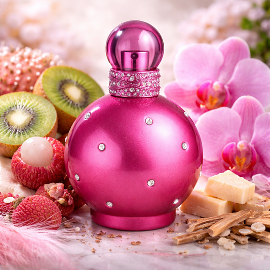 Pink perfume bottle with decorative elements on a surface with fruits and flowers