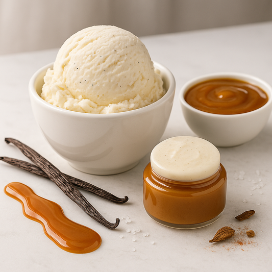 Vanilla ice cream in a bowl with caramel sauce, vanilla beans, and spices on a light surface.